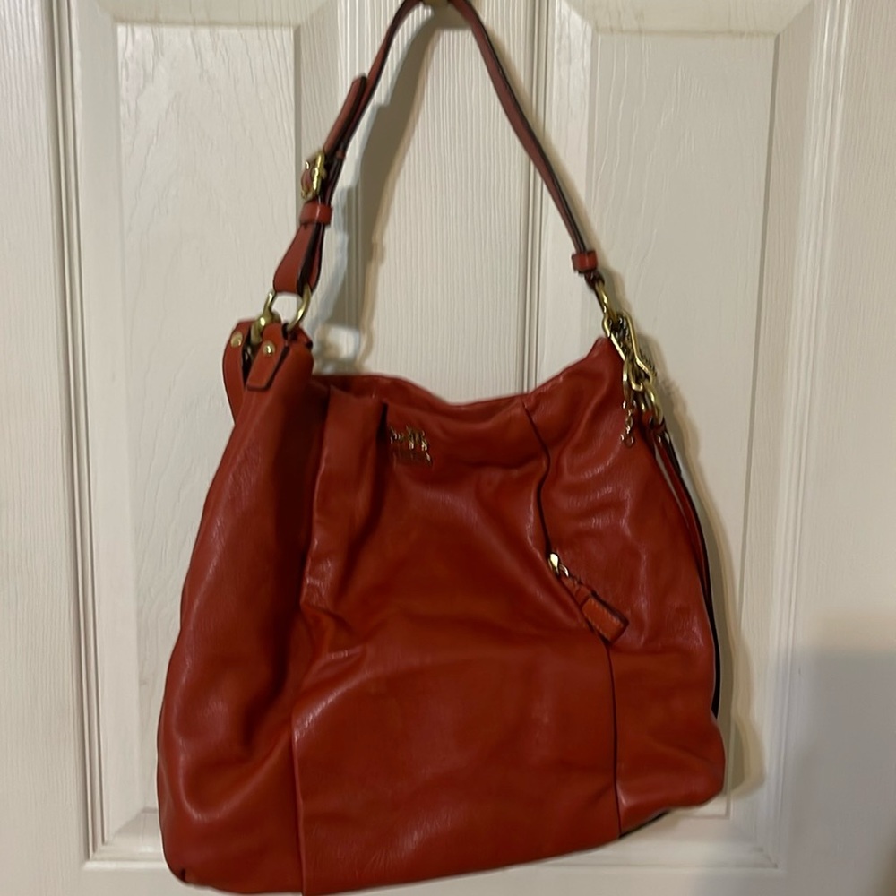 Coach bag.  Supple leather orange front side pocket